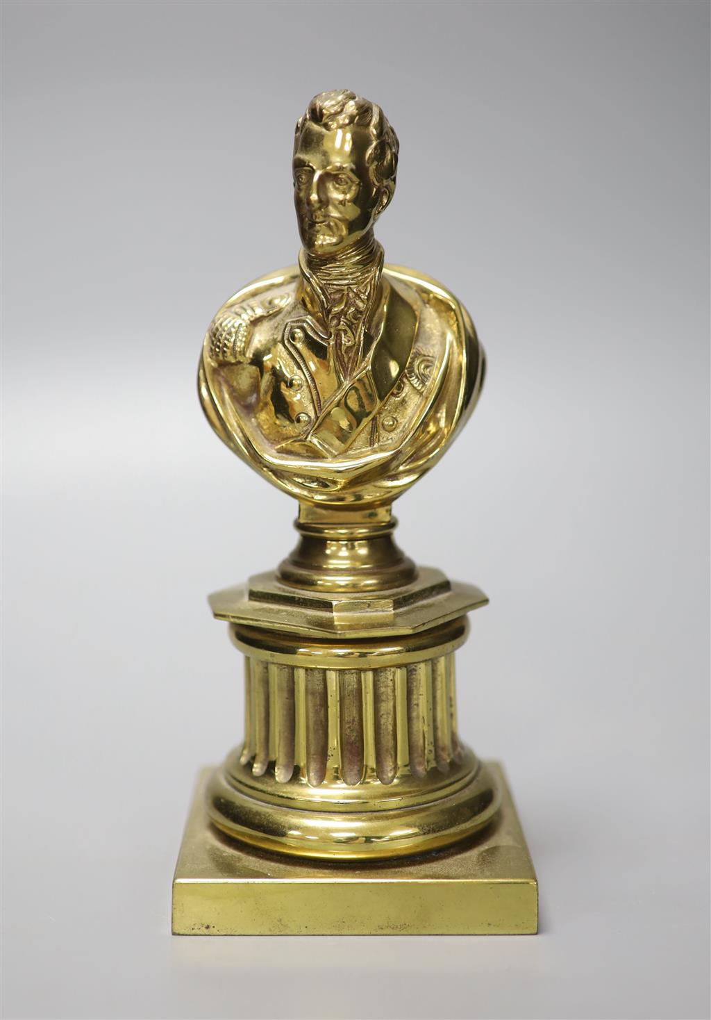 A 19th century brass bust of Wellington, 21cm high and two prints